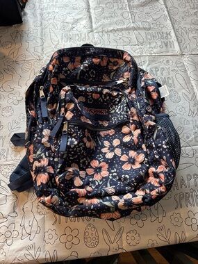 Jansport Navy Backpack with Peach Floral Print